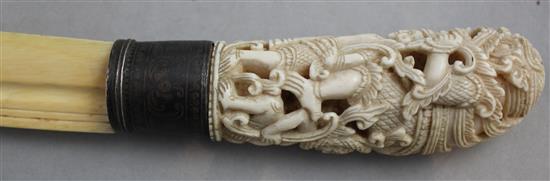 An early 20th century Indonesian ivory and silver mounted paperknife, 16.5in.